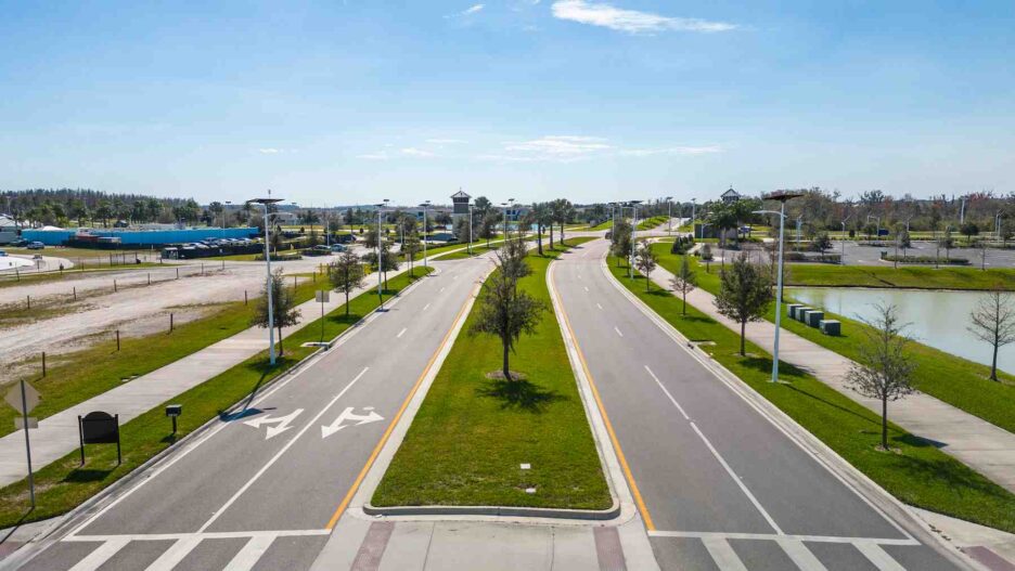 Solar streetlights along a divided roadway in Florida, providing resilient off-grid lighting for safe travel and community infrastructure.
