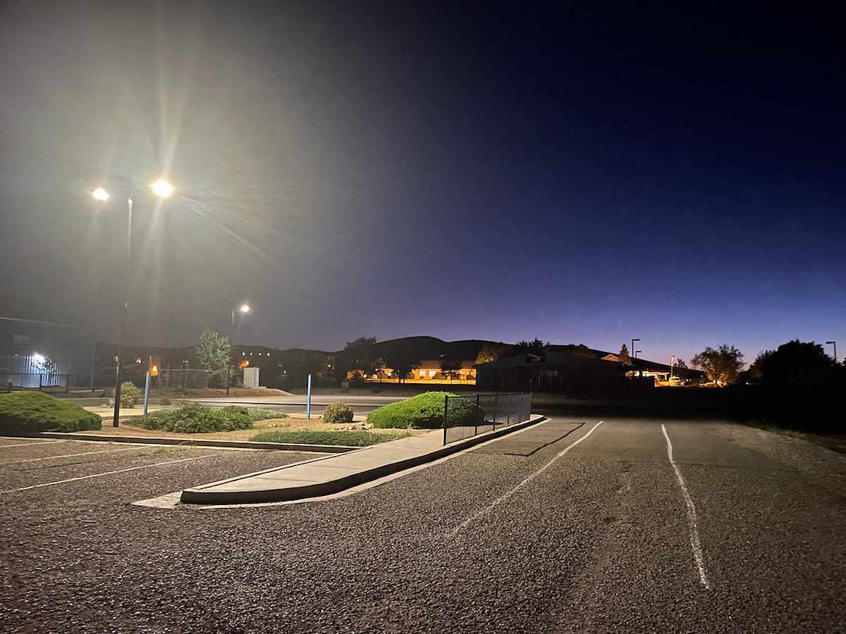 Solar-powered streetlights illuminating a parking lot in Alabama, providing reliable off-grid lighting for safer community spaces.