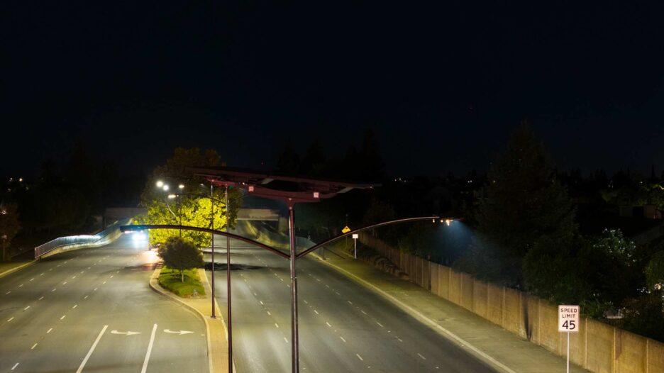 Solar streetlights illuminating a California roadway at night, grid-free LED lighting for safer streets