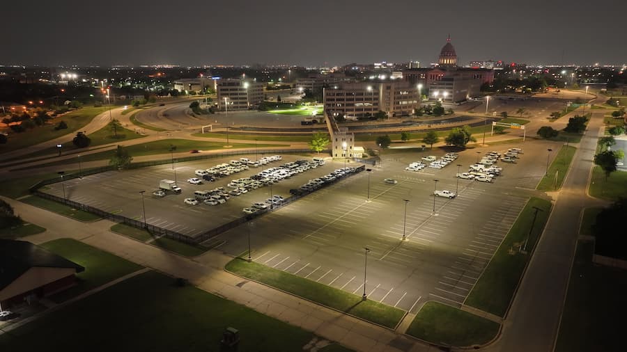 Commercial-grade solar lights installed in a large parking lot for energy efficiency.