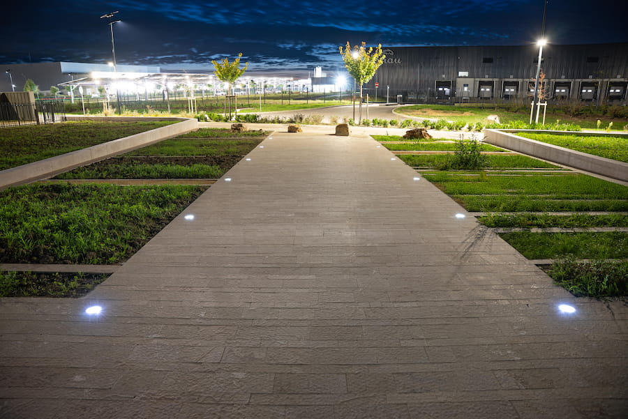 Solar-powered pathway lights at a commercial property, providing safe and energy-efficient illumination.