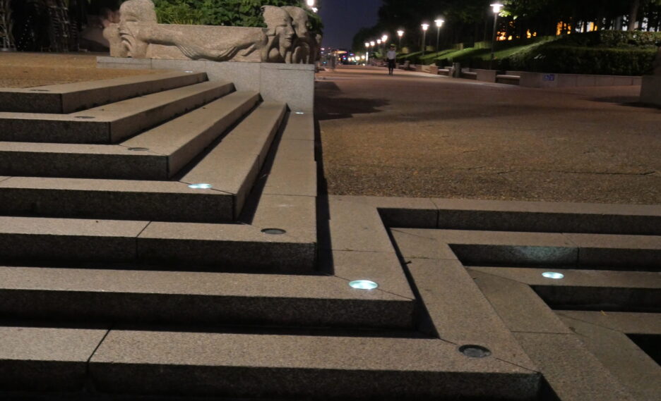 Solar-powered crystal studs embedded in outdoor stairway steps, enhancing safety and visibility at night with subtle off-grid lighting.