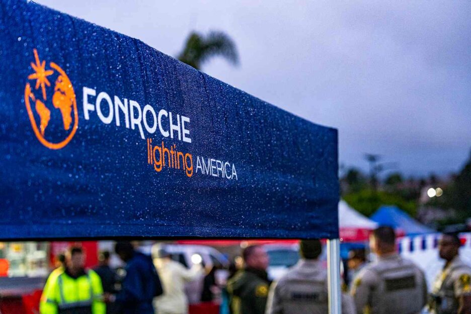 Fonroche Lighting America canopy at a community event in Texas, showcasing local engagement and solar lighting advocacy.