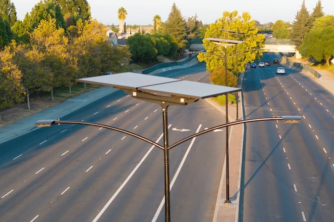 Fonroche solar lighting system components, including NiMH battery, panel, and controller.