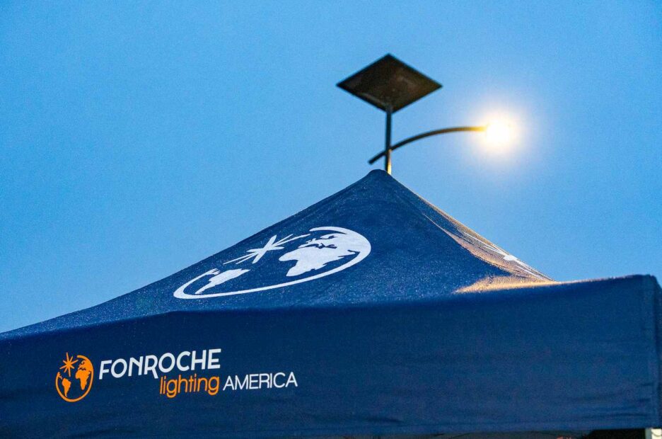 Fonroche Lighting America solar-powered streetlight illuminated at night, showcasing grid-free and maintenance-free lighting technology