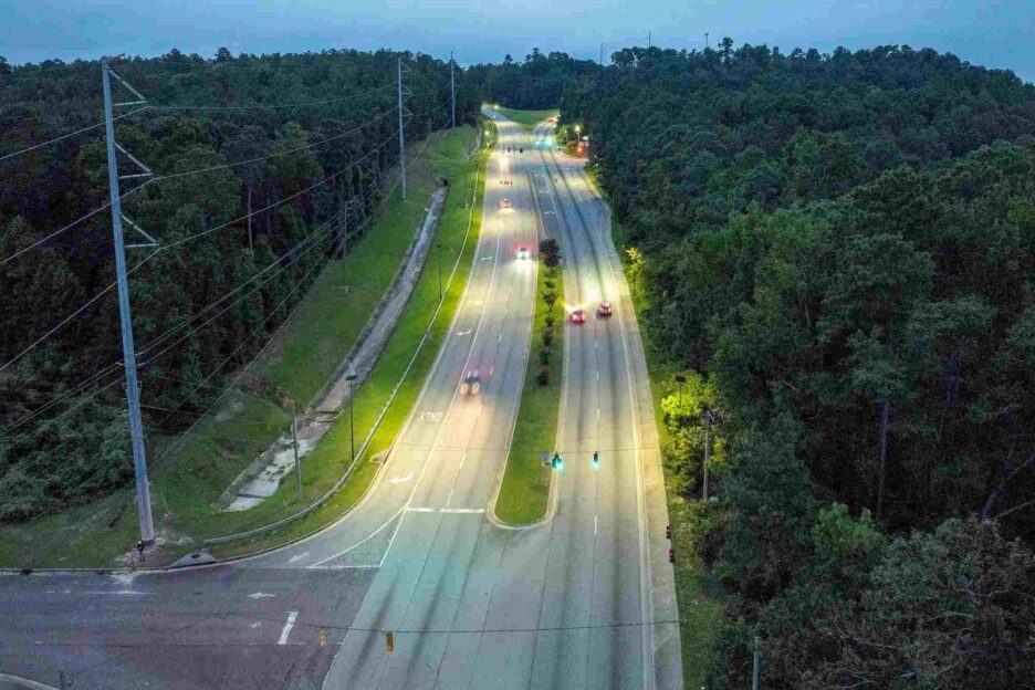 Aerial view of a Georgia highway illuminated by solar-powered street lights, providing reliable and sustainable roadway lighting.
