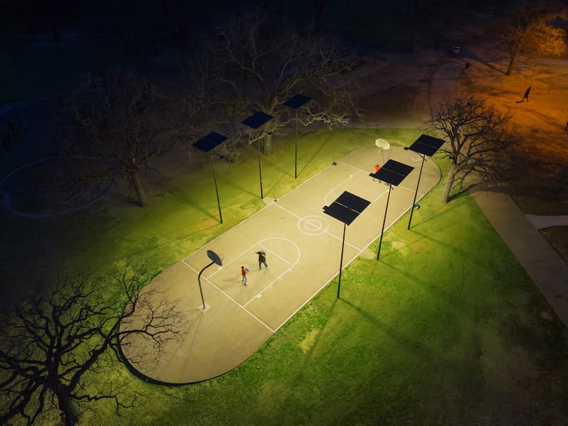 Municipal solar lighting system installed in a city park and basketball court