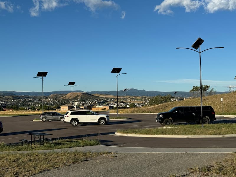 Solar lighting in a parking lot with aging infrastructure, avoiding costly underground repairs.