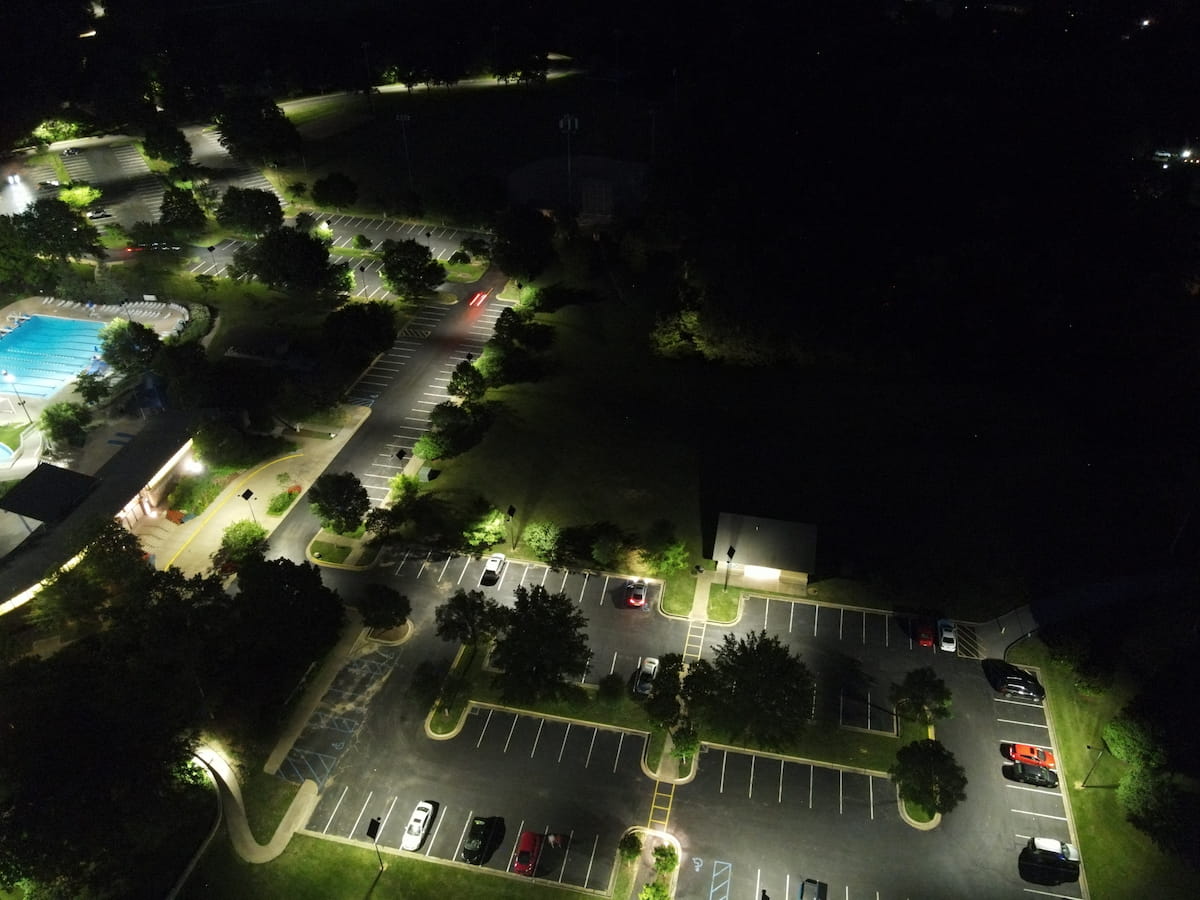 LED solar-powered parking lot lighting providing bright, energy-efficient illumination for large areas.
