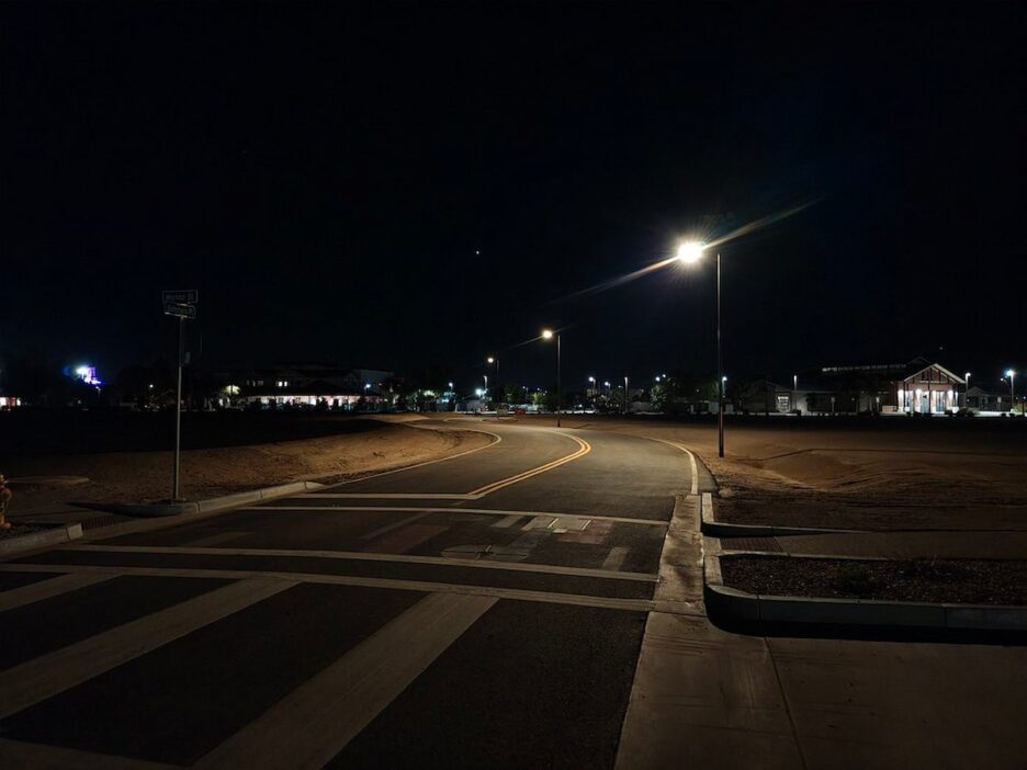 Solar-powered streetlights illuminating a California roadway at night, providing safe and reliable lighting during wildfire-related power shutoffs