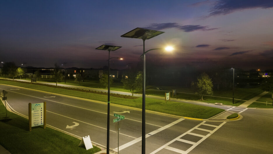 Off-grid solar streetlights illuminating a Florida roadway at dusk, providing resilient and reliable lighting independent of the electrical grid.