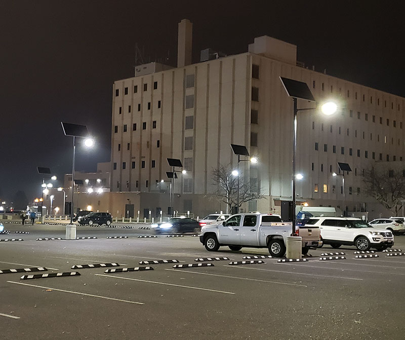 Solar streetlights installed at a military facility, providing off-grid security lighting for high-priority areas.
