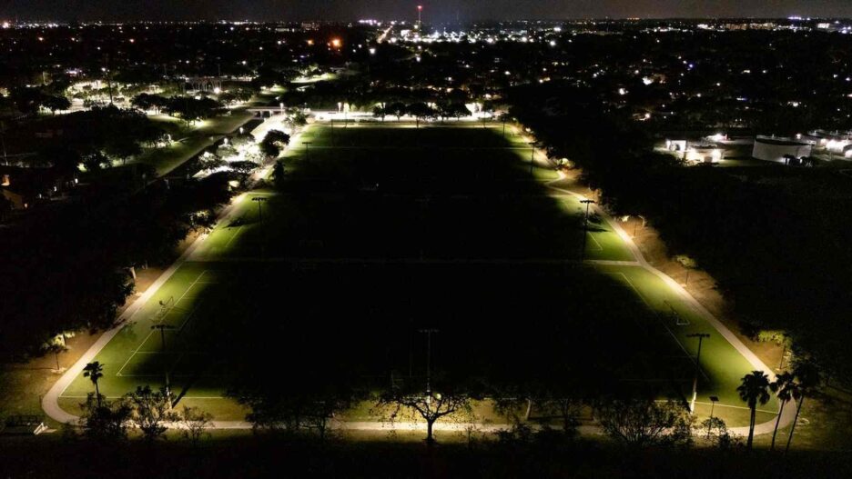 Solar lighting illuminating a North Florida school playground during the early evening hours.